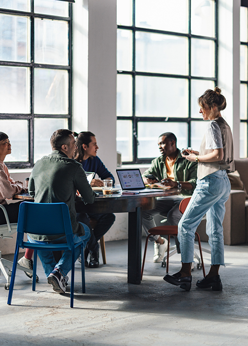 Young Professionals Collaborating in a Modern Co-Working Space